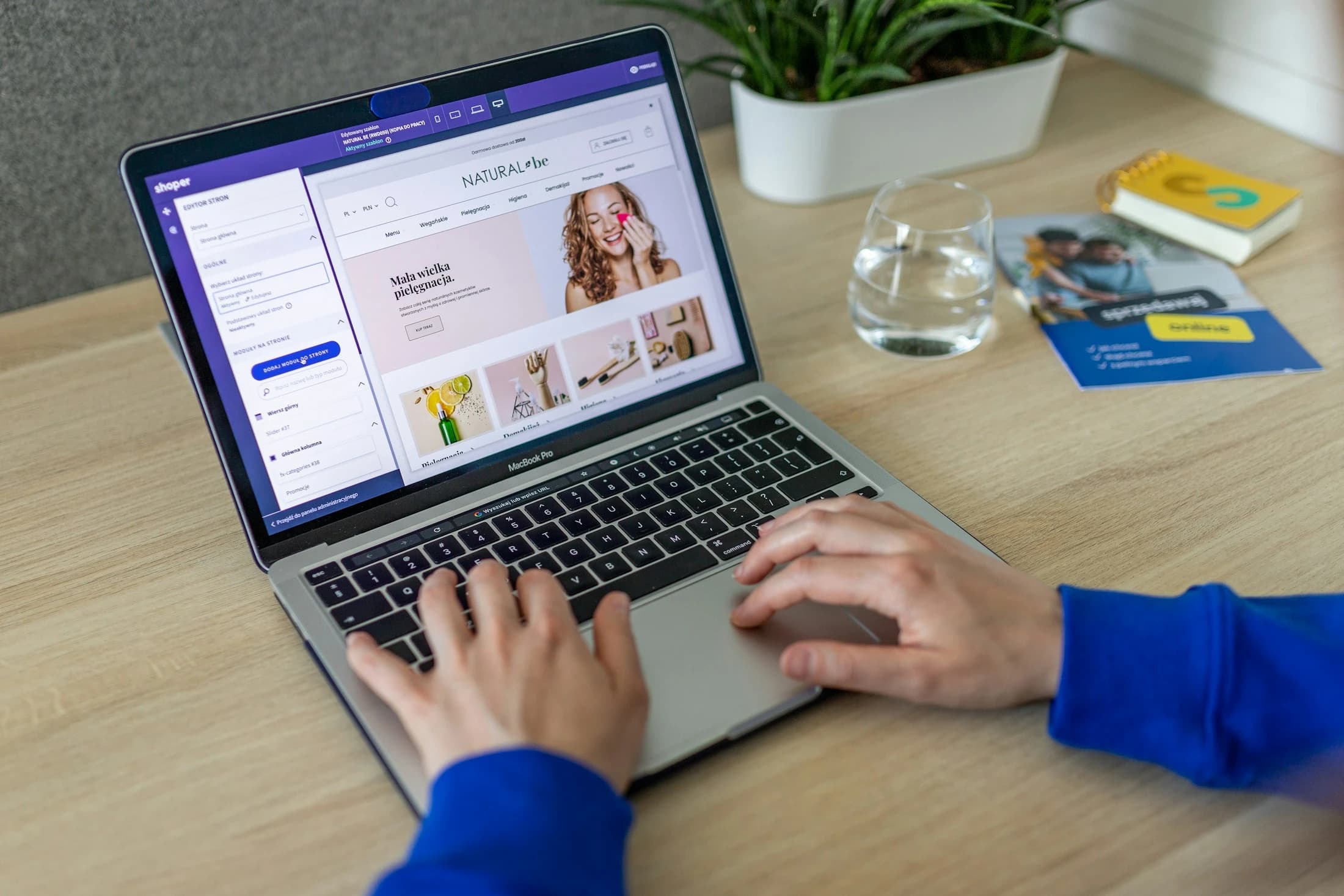 Person shopping on a laptop at a desk